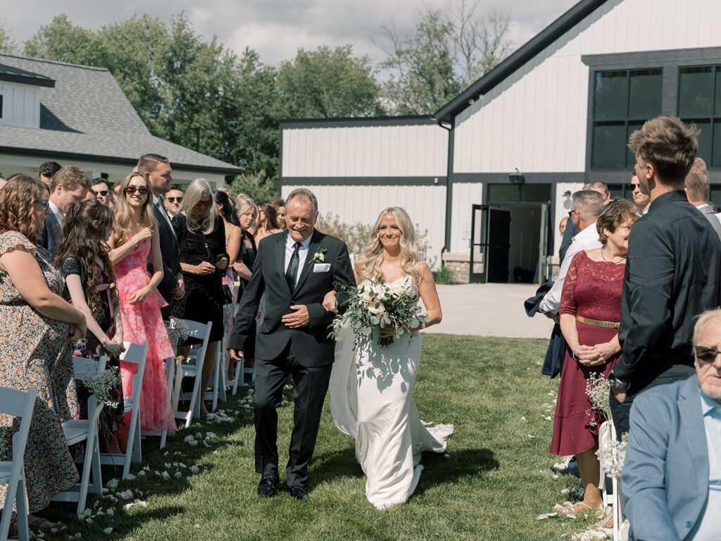 Bride walking down the aisle with her dad at Bella Giornata outdoor ceremony