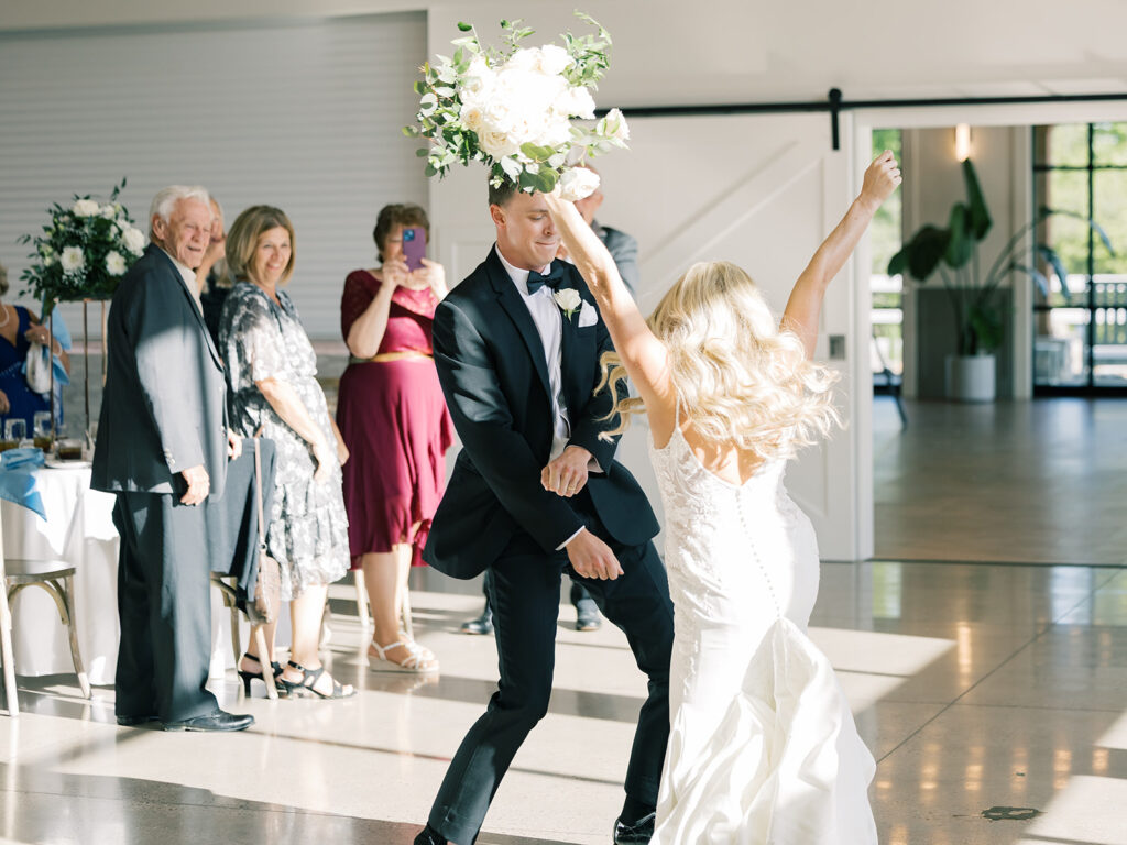 Bride and groom dance into their reception grand entrance at Bella Giornata